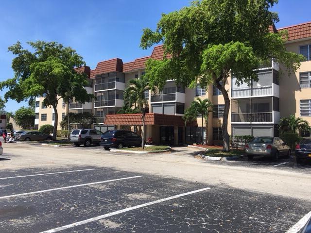 4154 Inverrary Drive, Unit 407 Lauderhill, FL 33319 - Photo 25 of 39 a view of a street with cars