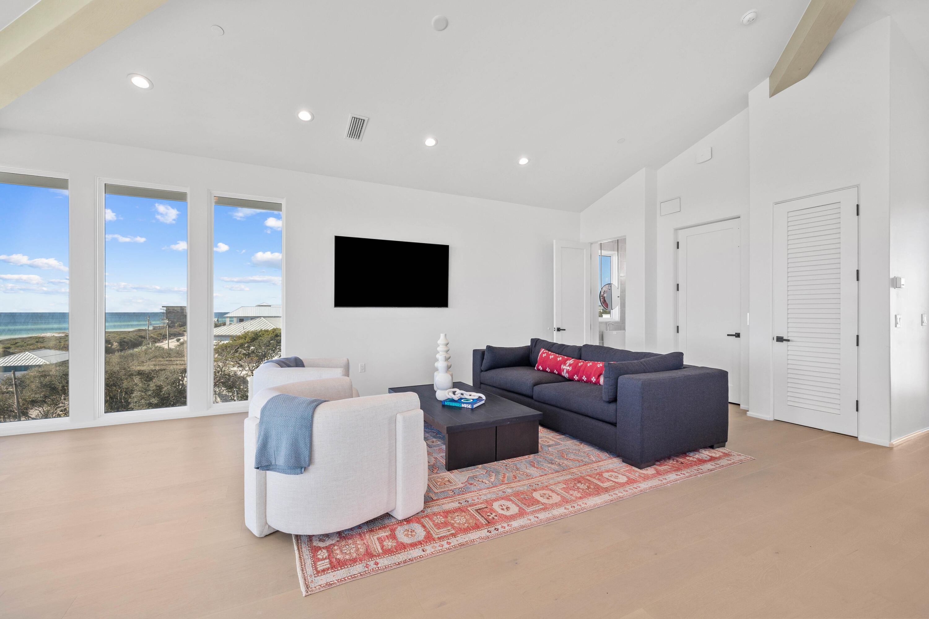 244 West Park Pl Avenue Inlet Beach, FL 32461 - Photo 47 of 49 a living room with furniture and a flat screen tv