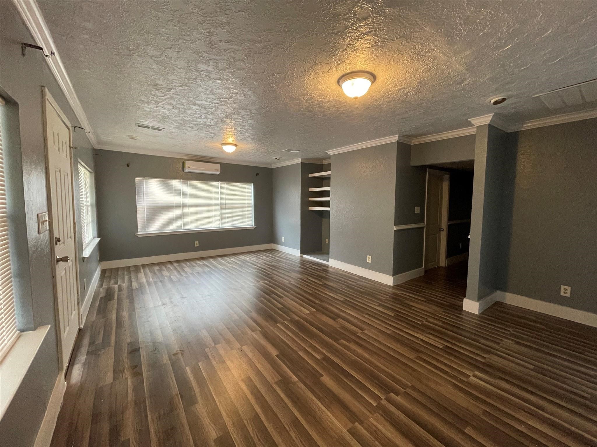 111 Cronin Road Shepherd, TX 77371 - Photo 6 of 16 wooden floor in an empty room with a window
