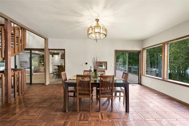a view of a dining room with furniture window and outside view