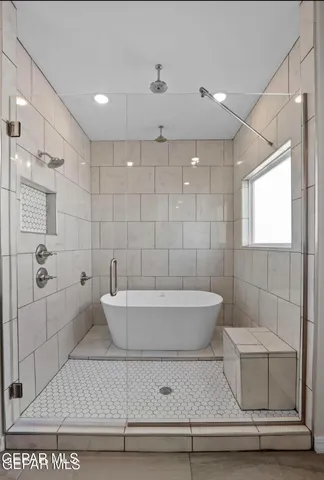a bathroom with a bathtub and toilet
