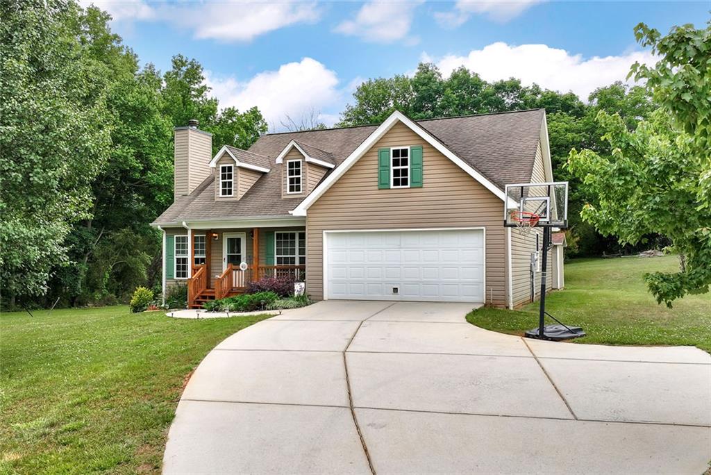 1044 Lothridge Road Cleveland, GA 30528 - Photo 39 of 40 a front view of a house with a yard and trees