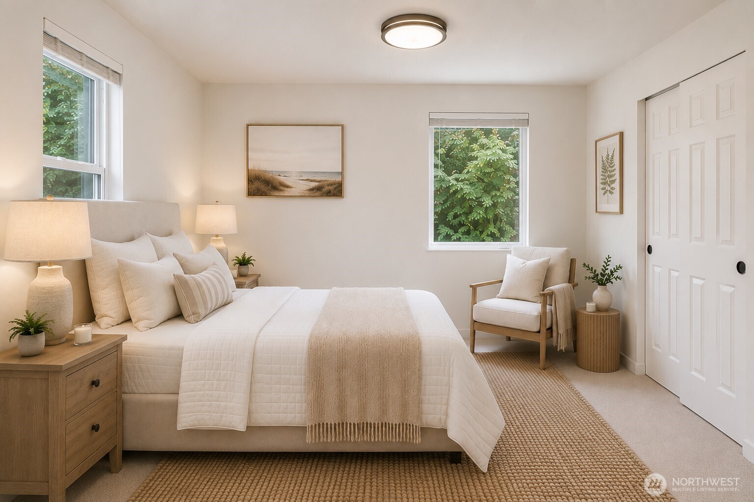 7605 Northeast Hidden Cove Road Bainbridge Island, WA 98110 - Photo 11 of 36 a bedroom with a bed and a large window