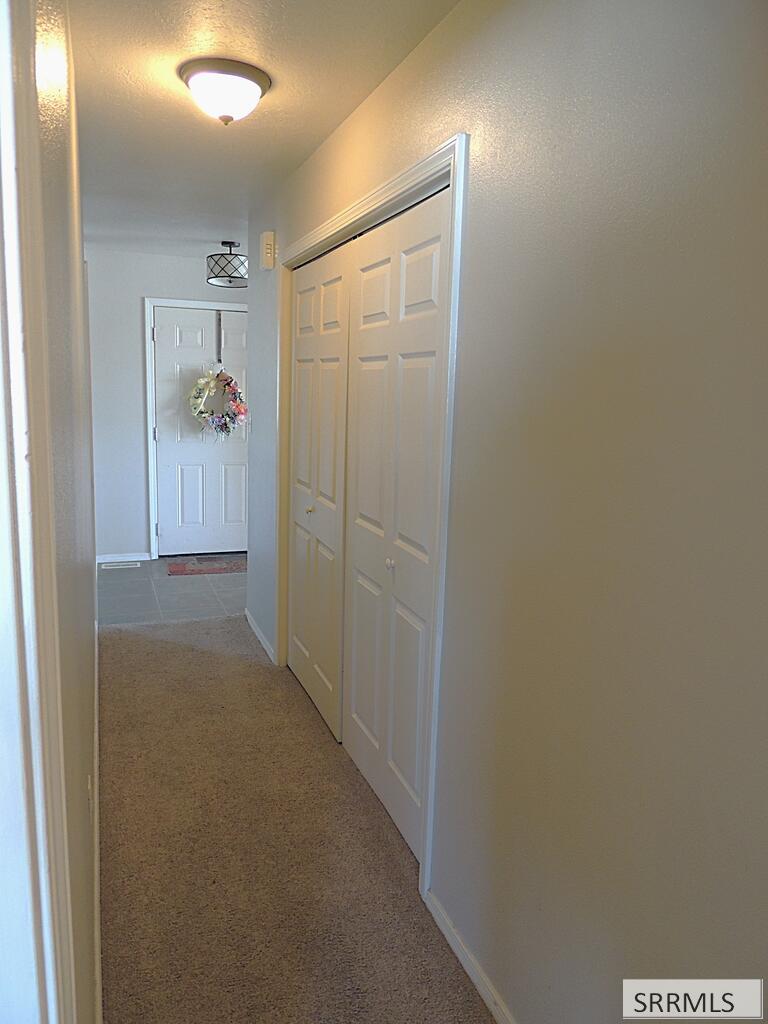 27 North White Pne Lane Rigby, ID 83442 - Photo 20 of 25 Hall closet with laundry