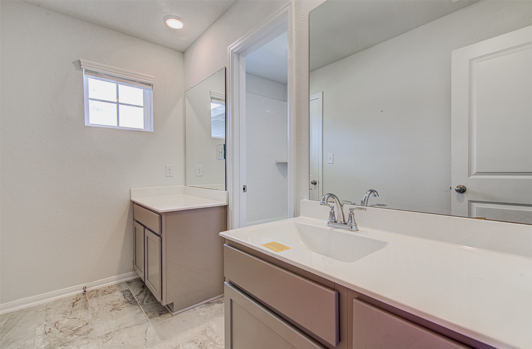 774 Cherrystone Loop Buda, TX 78610 - Photo 24 of 38 Dual vanities with ample counter space offer practical elegance for daily routines.