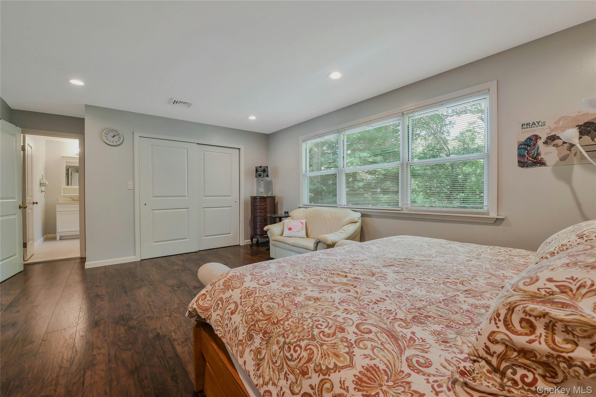 27 Upper Sheep Pasture Road East Setauket, NY 11733 - Photo 14 of 25 a bedroom with a large bed and a window