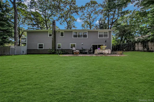 a front view of house with yard and seating area