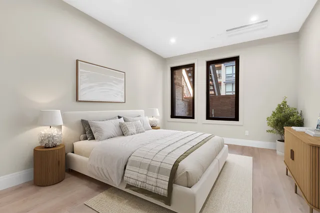 a view of a patio with couches table and chairs and potted plants