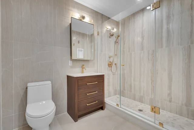 a bedroom with a bed and large window