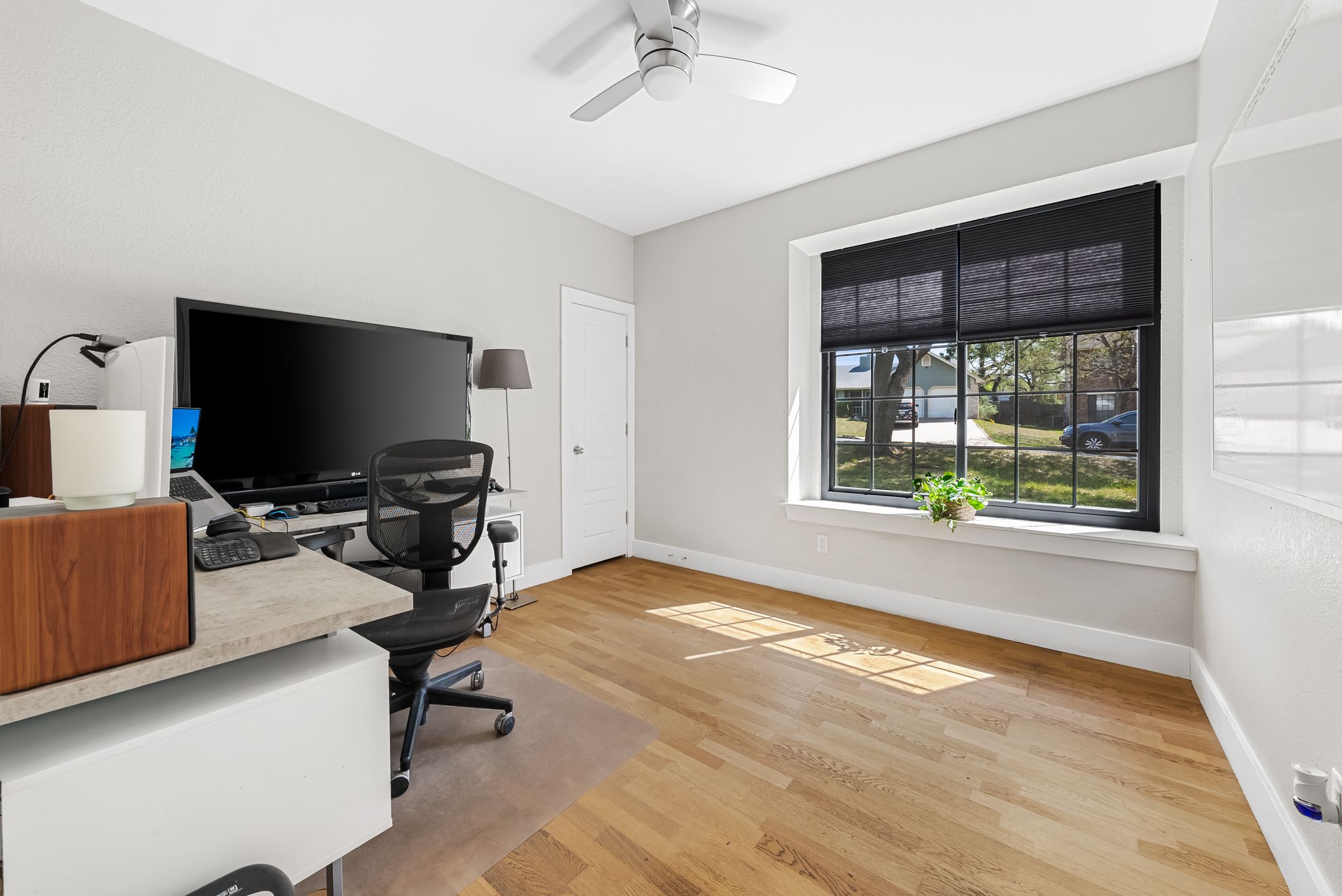 1714 Prairie Hen Cove Austin, TX 78758 - Photo 12 of 35 a view of a livingroom with workspace and a window