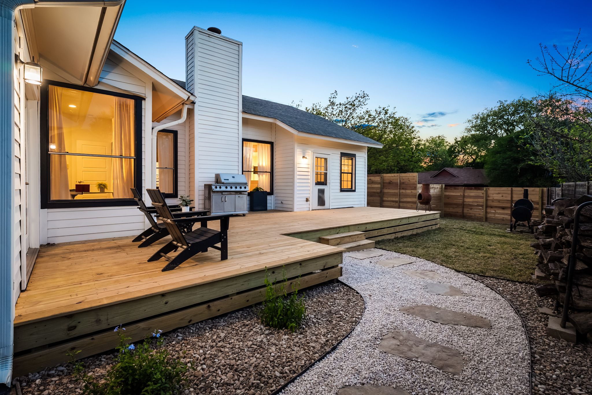 1714 Prairie Hen Cove Austin, TX 78758 - Photo 19 of 35 a view of a house with backyard sitting area and garden