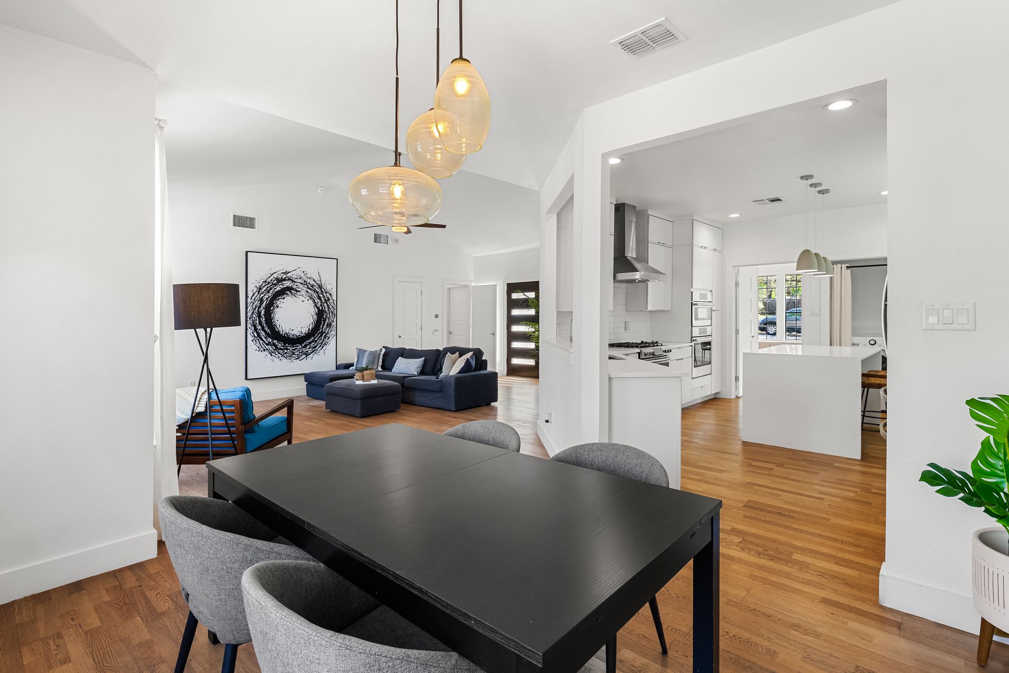 1714 Prairie Hen Cove Austin, TX 78758 - Photo 21 of 35 a view of a dining room with furniture and wooden floor