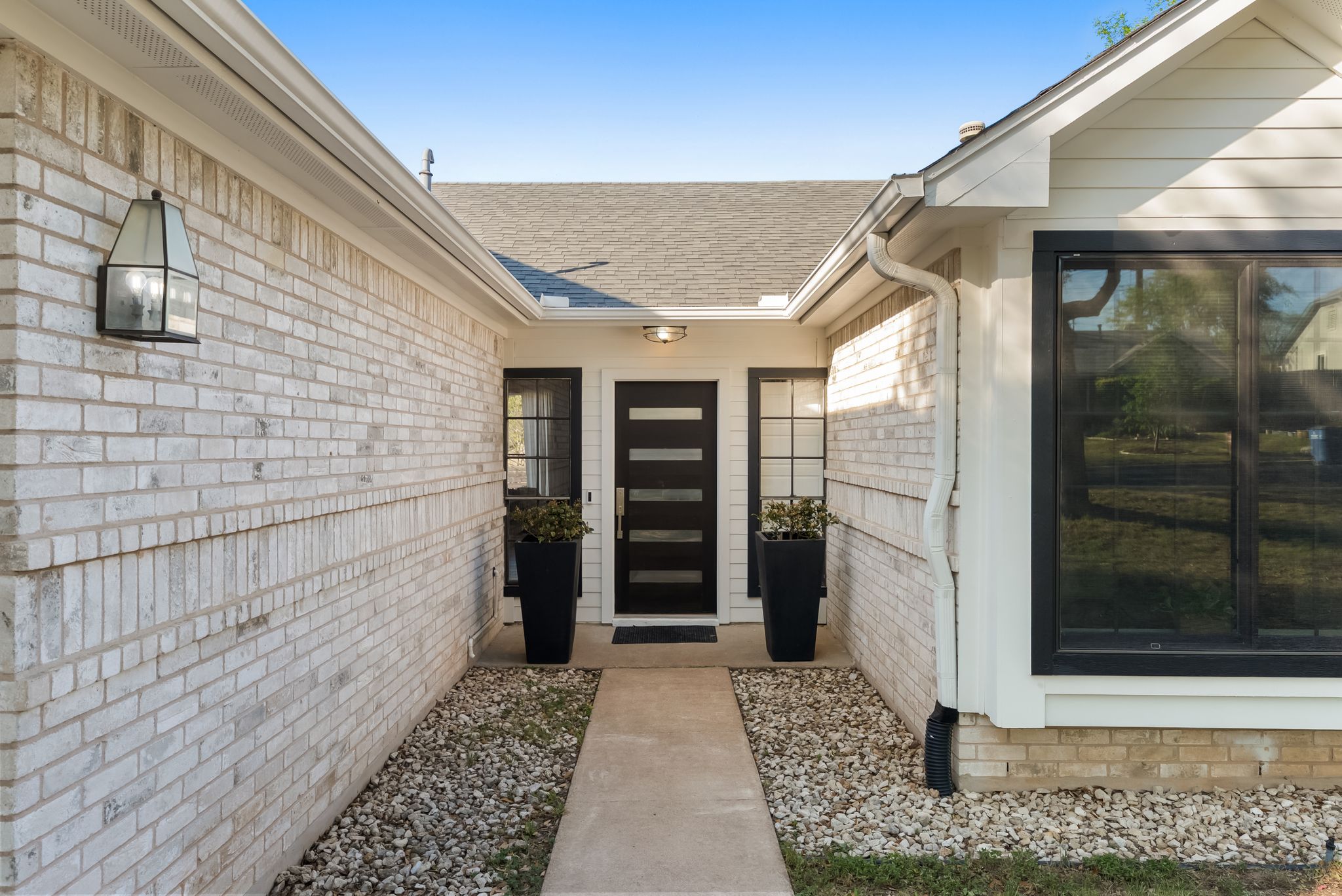1714 Prairie Hen Cove Austin, TX 78758 - Photo 26 of 35 a view of house with wooden floor and door