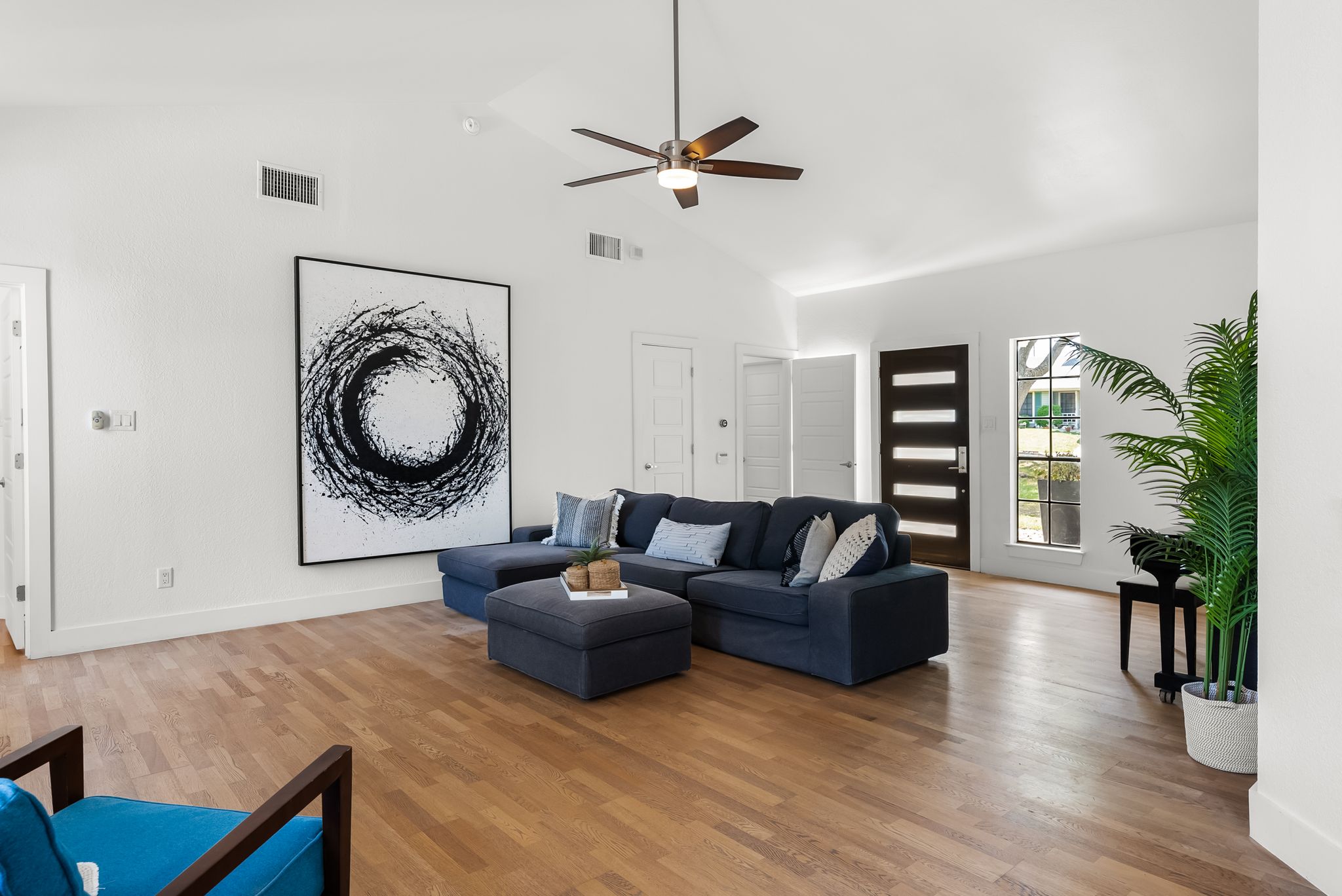 1714 Prairie Hen Cove Austin, TX 78758 - Photo 27 of 35 a living room with furniture and wooden floor
