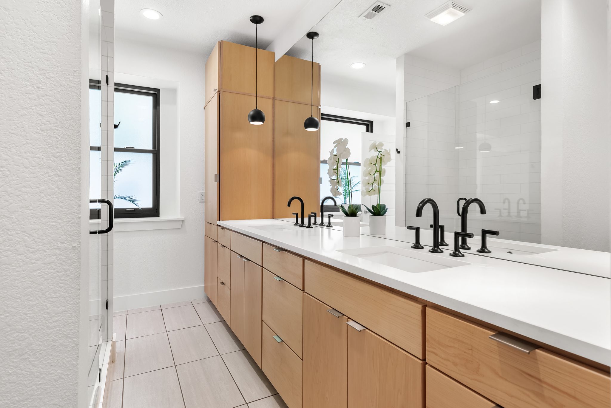1714 Prairie Hen Cove Austin, TX 78758 - Photo 6 of 35 a bathroom with a double vanity sink mirror and