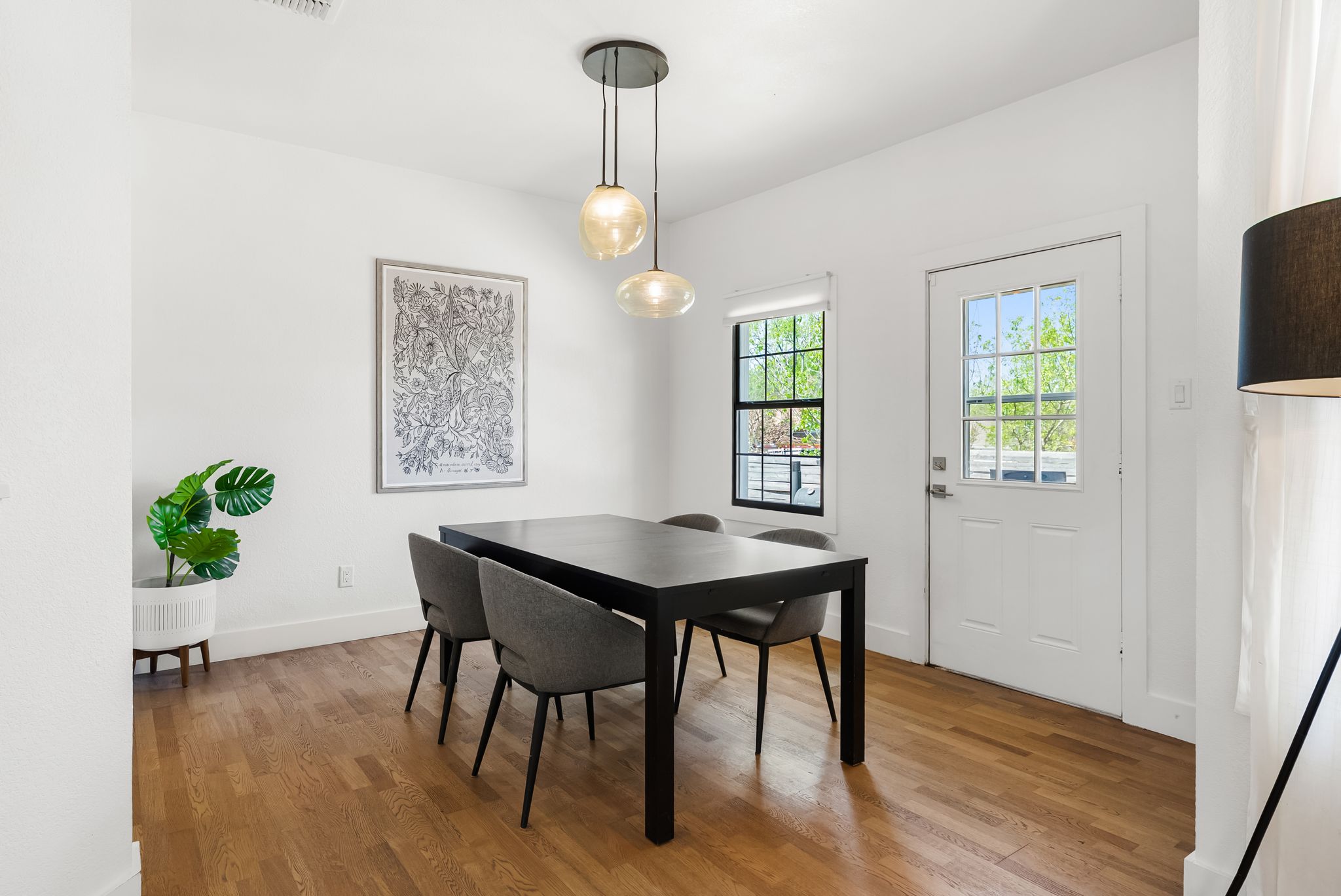 1714 Prairie Hen Cove Austin, TX 78758 - Photo 8 of 35 a view of a dining room with furniture window and wooden floor