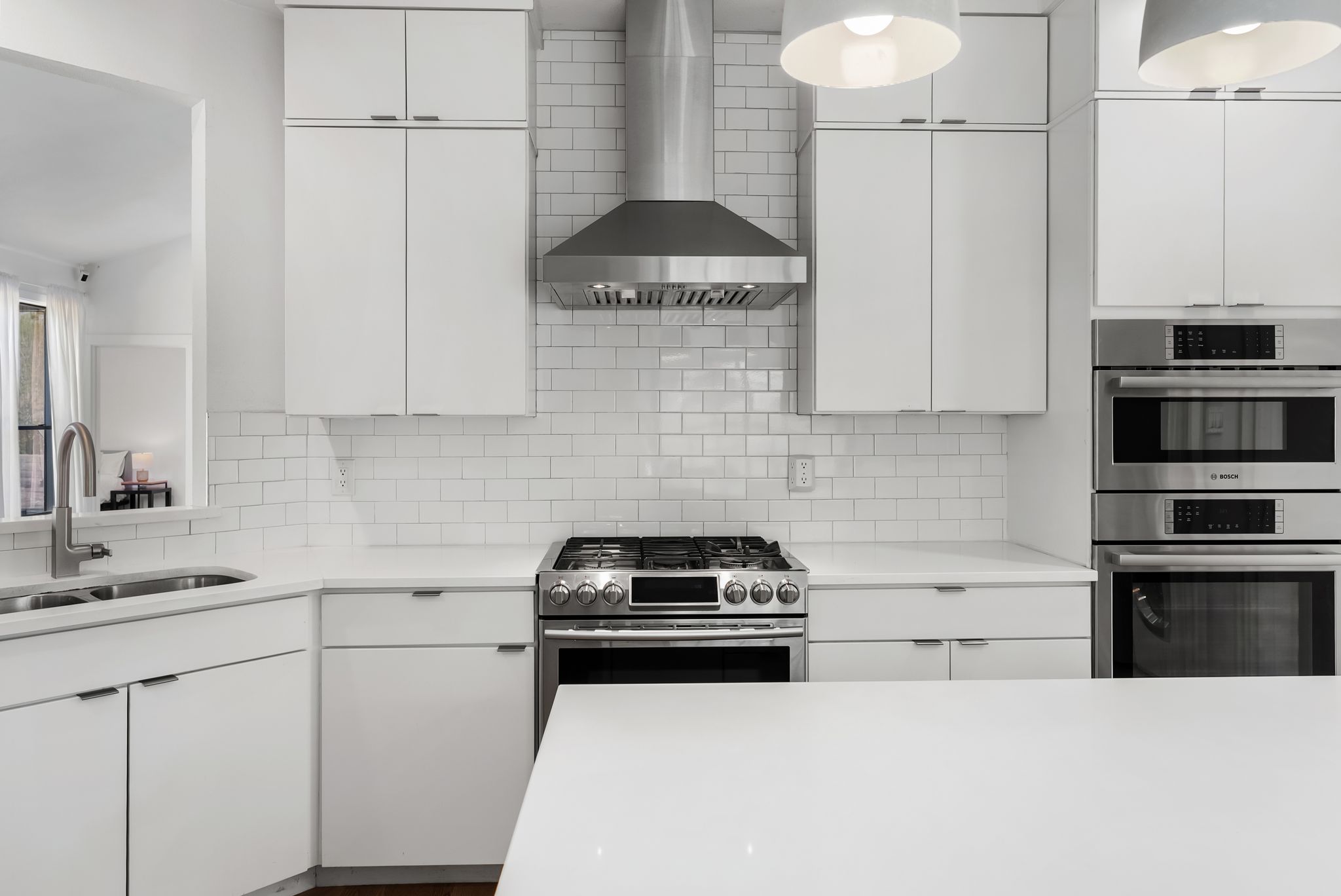1714 Prairie Hen Cove Austin, TX 78758 - Photo 9 of 35 a kitchen with a stove and white cabinets