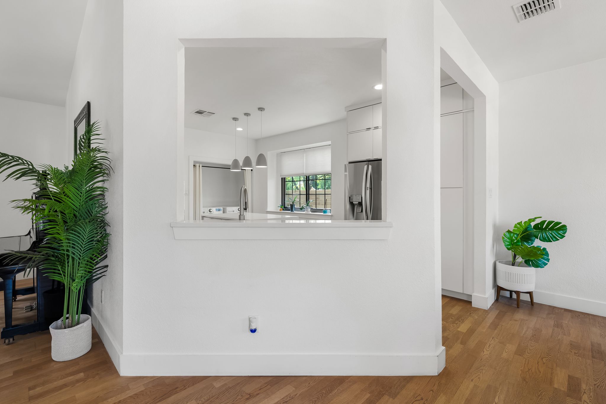 1714 Prairie Hen Cove Austin, TX 78758 - Photo 10 of 35 a view of an entryway with wooden floor