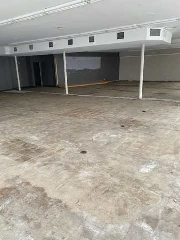 a view of a livingroom with an empty space and window