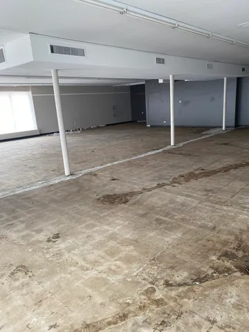 a view of storage and utility room with closet