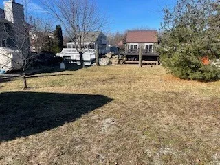 a view of a backyard with sitting area