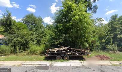 a side view of a car parked on the side of the road