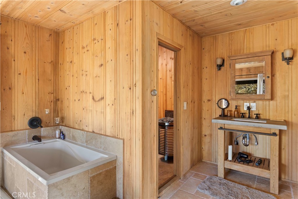 5200 Bartlett Springs Road Upper Lake, CA 95485 - Photo 13 of 36 a bathroom with a tub sink and mirror