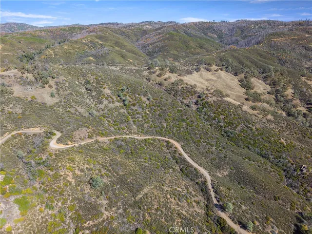 a view of a mountain range with trees