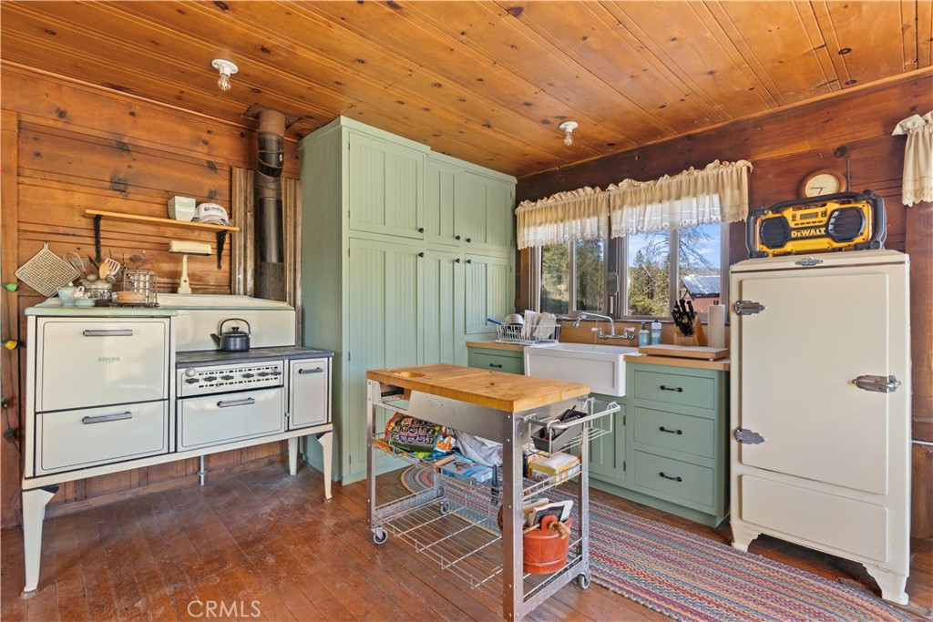 5200 Bartlett Springs Road Upper Lake, CA 95485 - Photo 8 of 36 a kitchen with a stove a refrigerator and a stove top oven