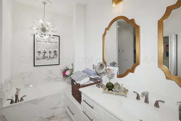 a bathroom with a double vanity sink and a mirror