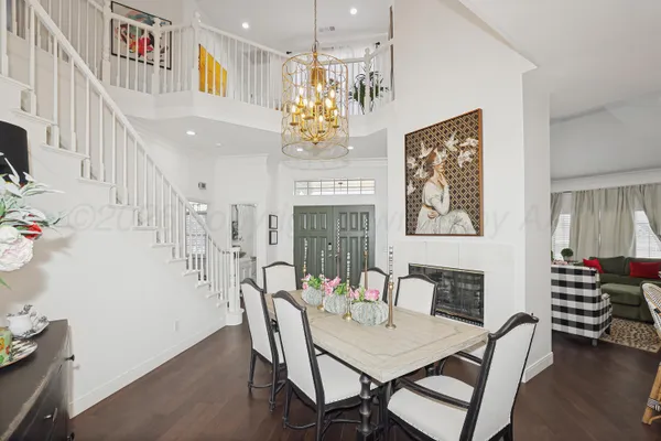 a view of a livingroom with furniture and staircase