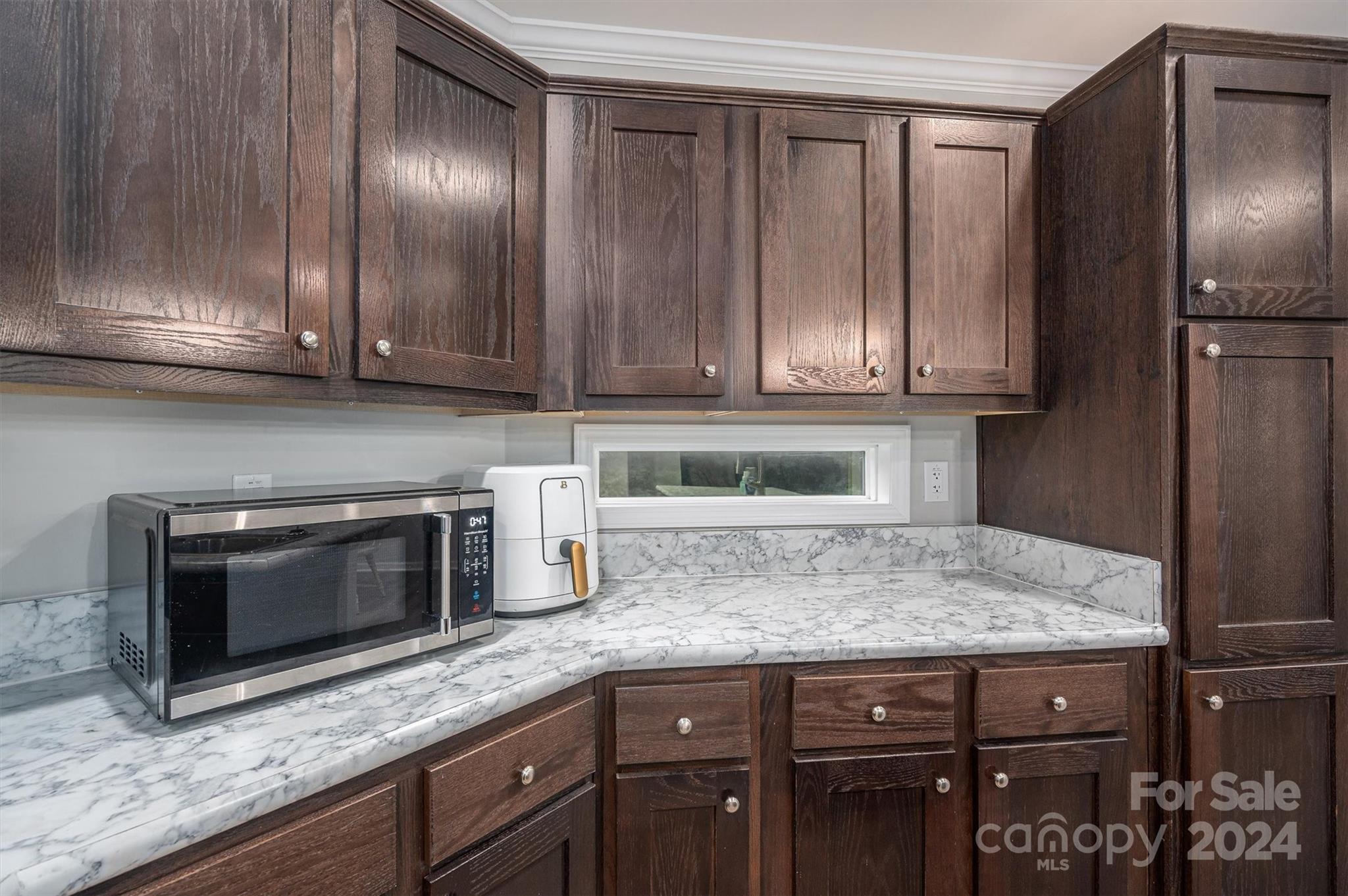 2388 Cat Square Road Vale, NC 28168 - Photo 14 of 33 a kitchen with granite countertop stainless steel appliances wooden cabinets and a counter top space
