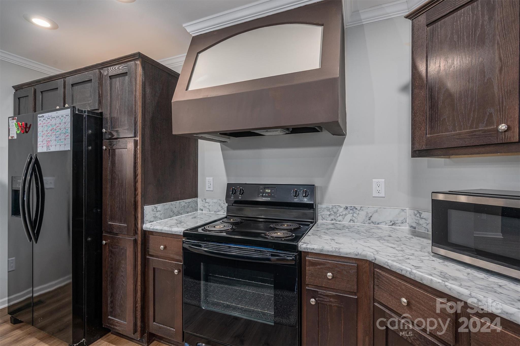 2388 Cat Square Road Vale, NC 28168 - Photo 16 of 33 a kitchen with granite countertop stainless steel appliances and wooden cabinets