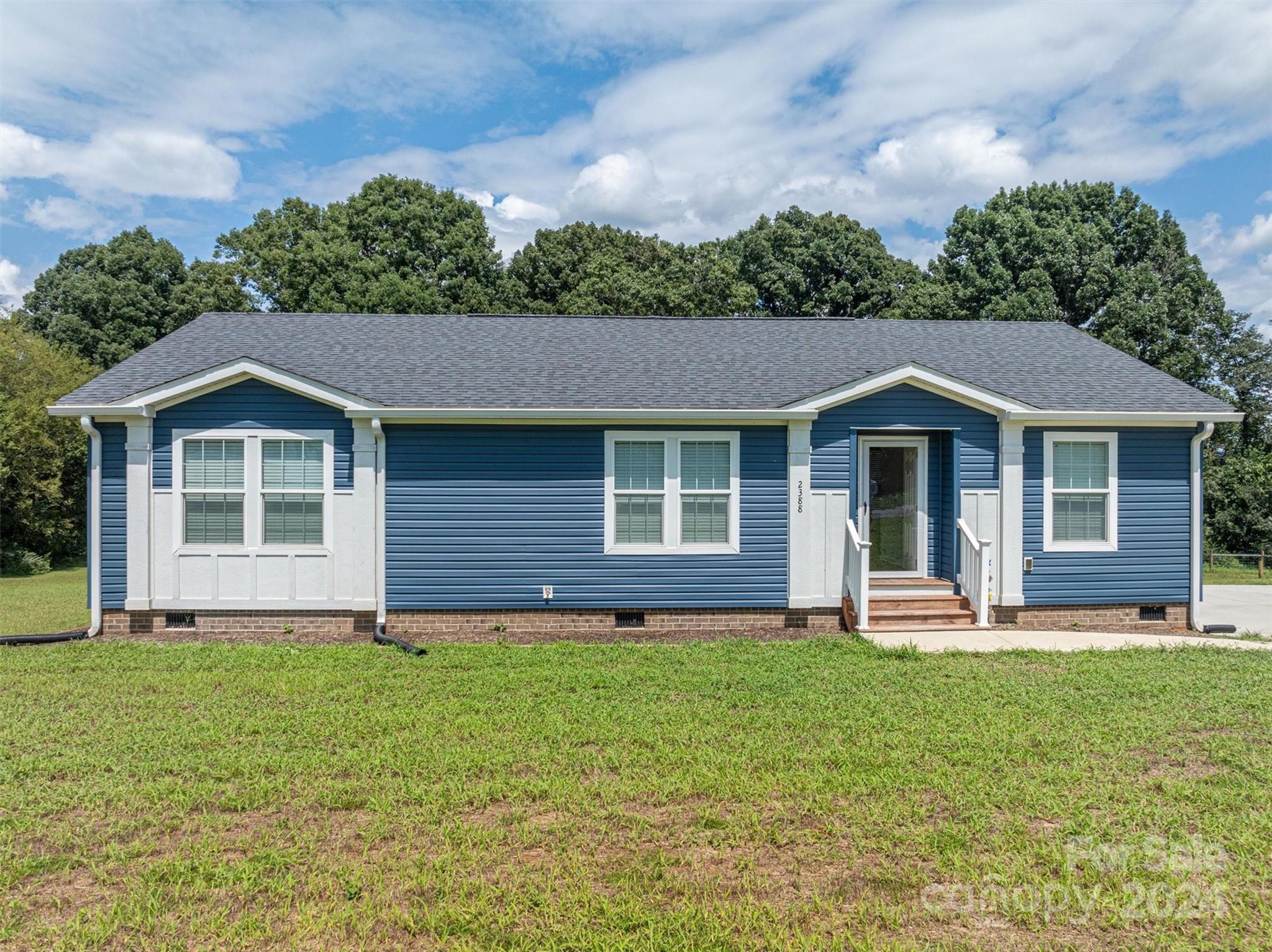 2388 Cat Square Road Vale, NC 28168 - Photo 2 of 33 a front view of a house with a yard and trees