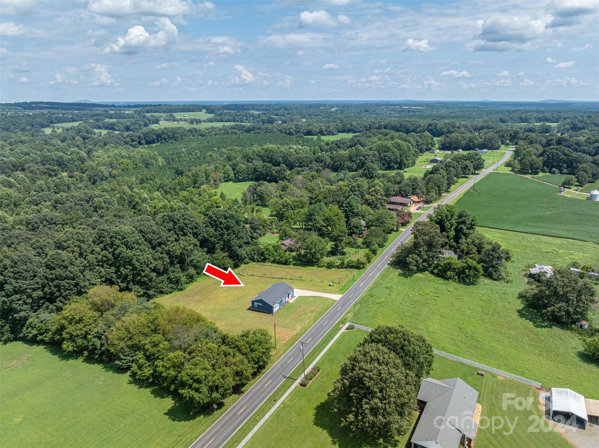 2388 Cat Square Road Vale, NC 28168 - Photo 8 of 33 a view of a green field with lots of flower in it