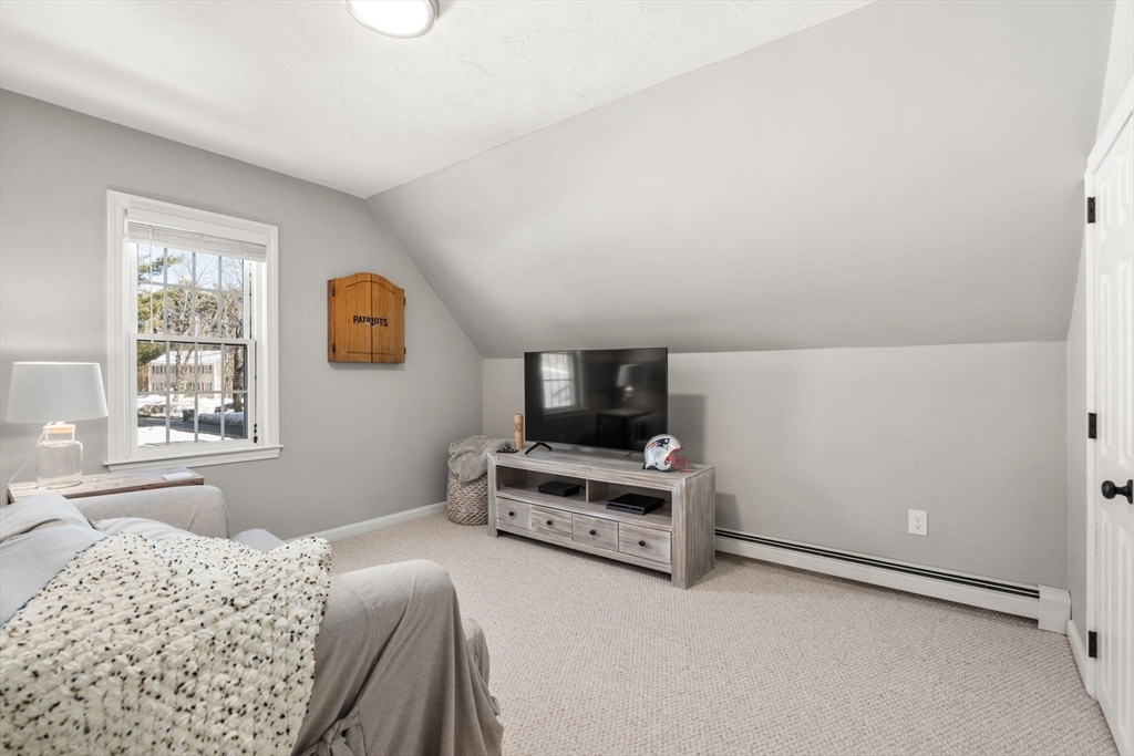 738 Whiting Street Hanover, MA 02339 - Photo 24 of 32 a bedroom with a bed and a window