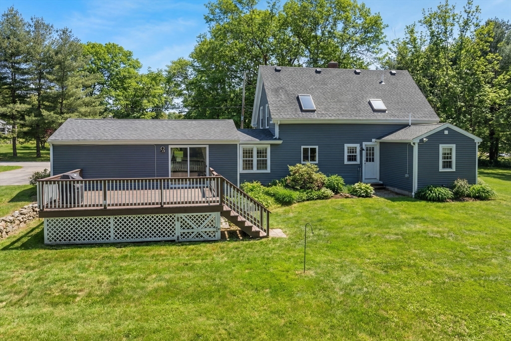 738 Whiting Street Hanover, MA 02339 - Photo 3 of 32 a house view with a garden space