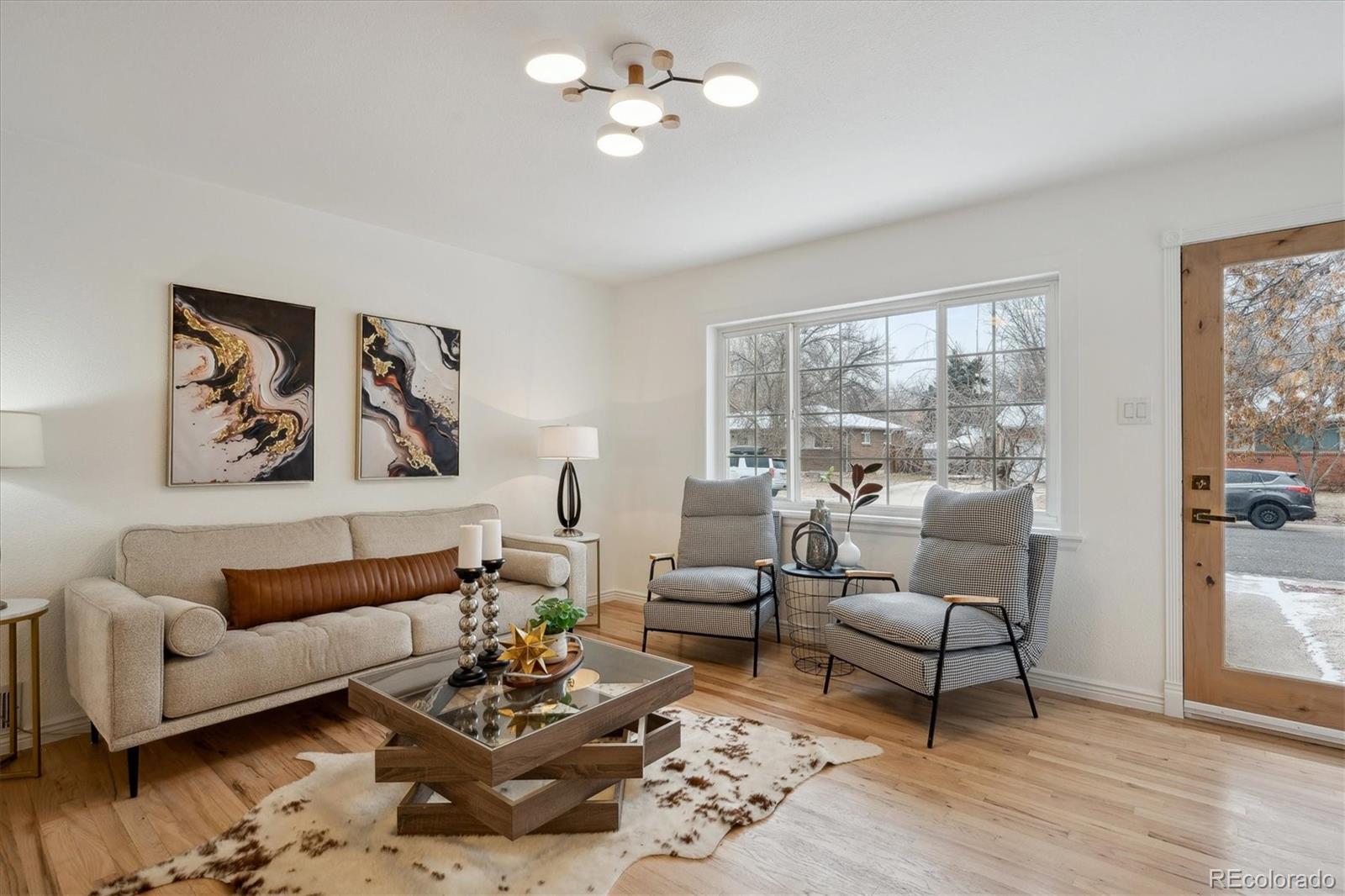 6300 Janice Way Arvada, CO 80004 - Photo 4 of 33 a living room with furniture and a large window