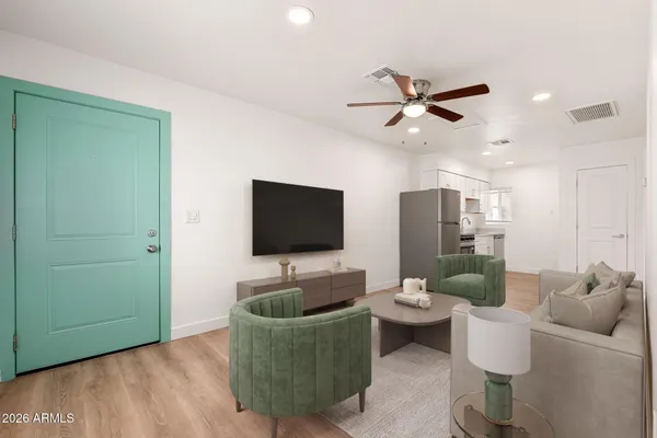 a living room with furniture and a flat screen tv