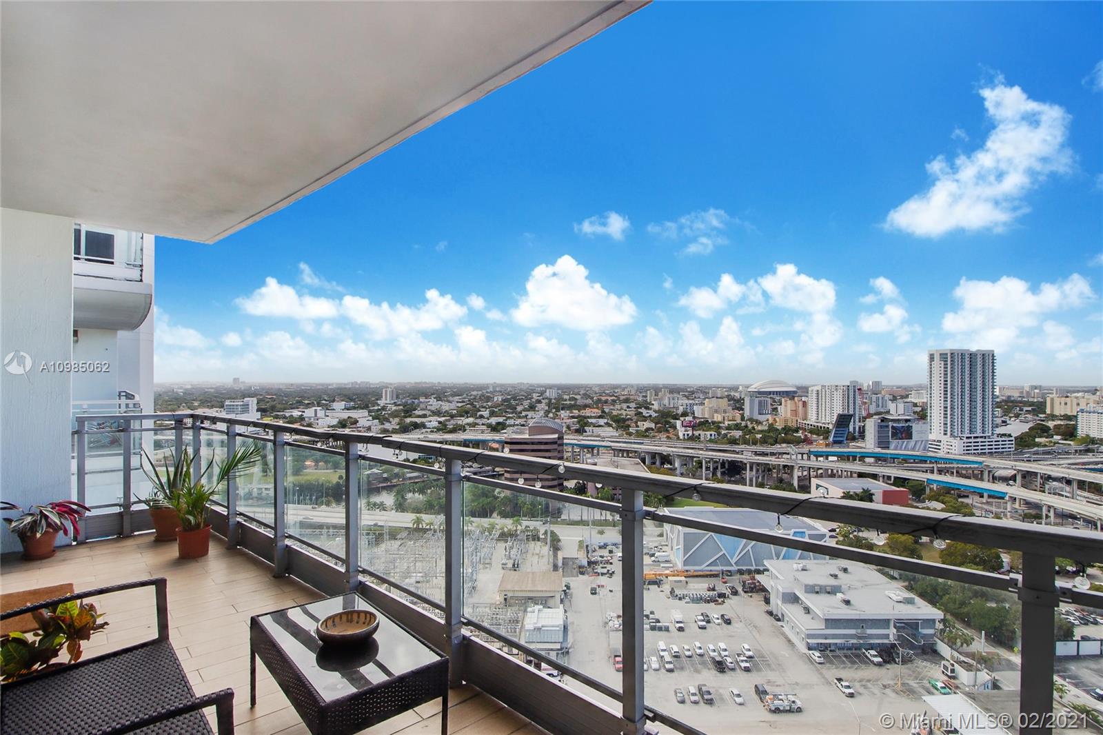 90 Southwest 3rd Street, Unit 2406 Miami, FL 33130 - Photo 11 of 12 a view of a balcony with wooden floor