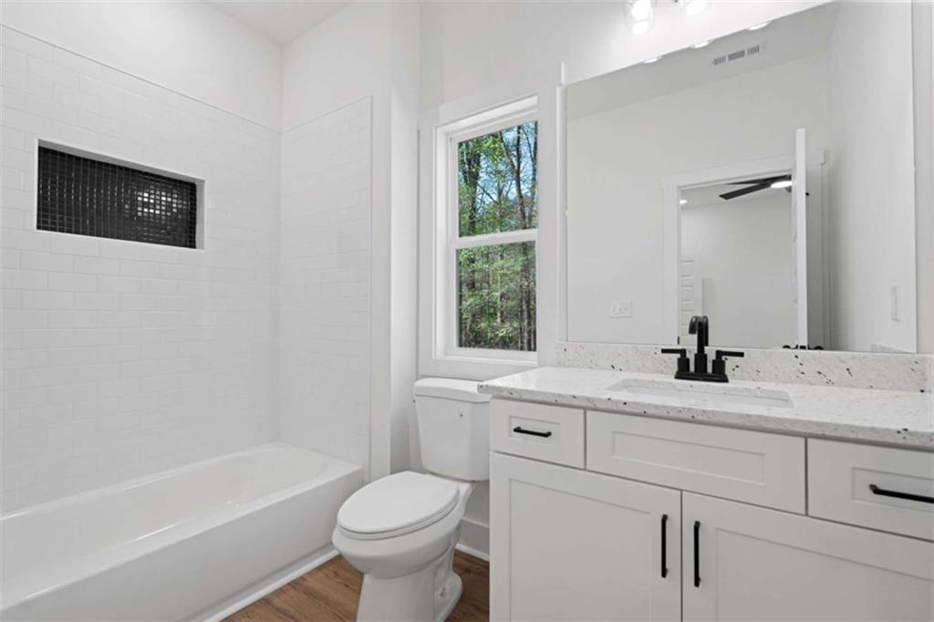 11691 Hazelbrand Road Northeast Covington, GA 30014 - Photo 25 of 53 a bathroom with a sink a toilet and a bathtub