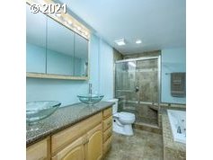 37130 Southwest Goddard Road Cornelius, OR 97113 - Photo 22 of 31 a bathroom with a granite countertop sink a toilet and shower