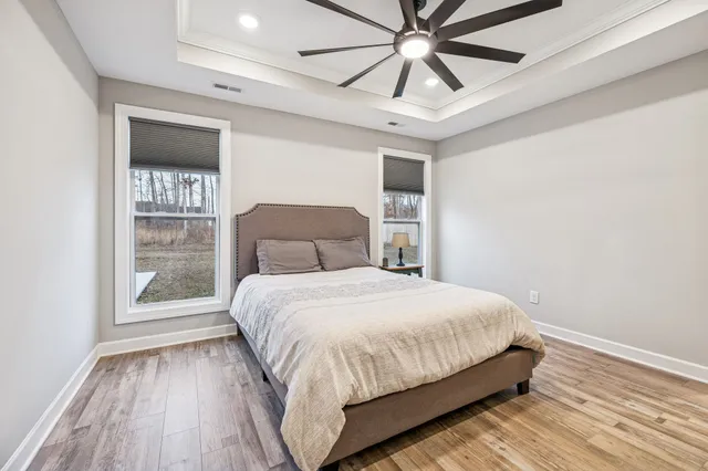 a bathroom with a granite countertop sink toilet bathtub and shower