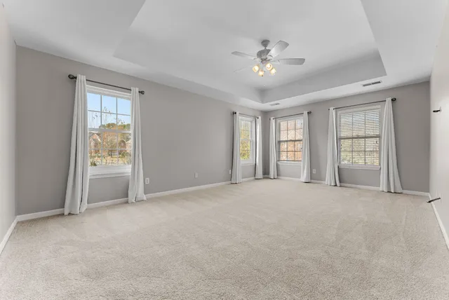 a view of empty room with a fireplace