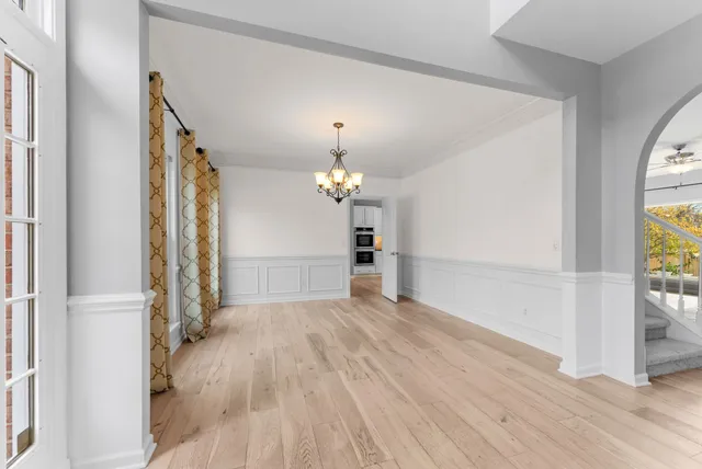 a view of a livingroom with a fireplace and a workspace
