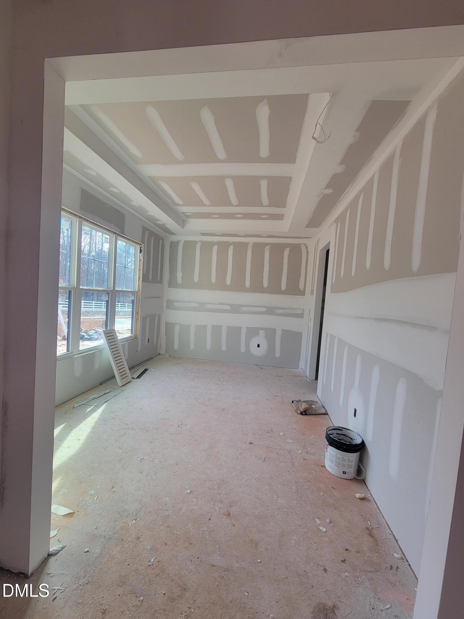 8721 Little Deer Lane Raleigh, NC 27613 - Photo 17 of 19 a view of an empty room with a fireplace