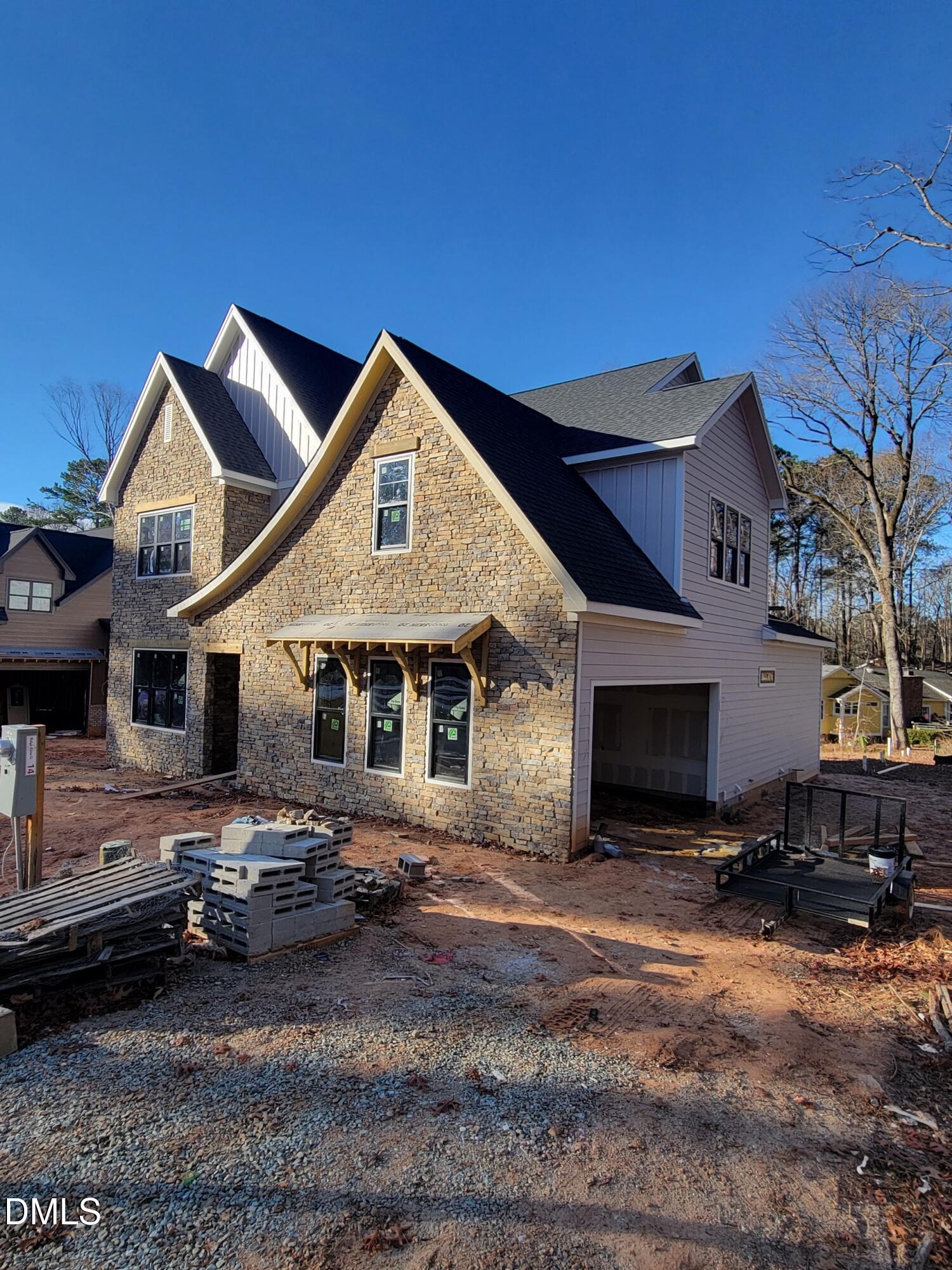 8721 Little Deer Lane Raleigh, NC 27613 - Photo 2 of 19 a front view of a house with a yard