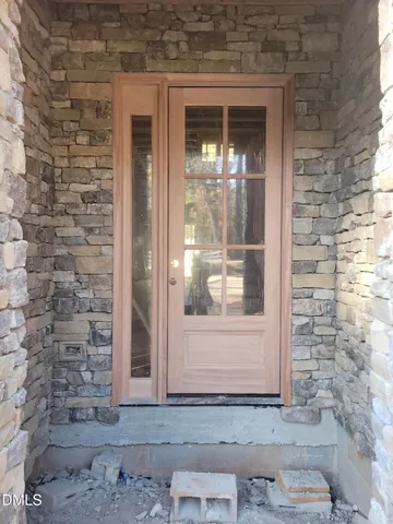 a front view of a house with a glass door
