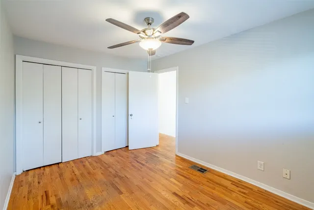 a view of a big room with wooden floor