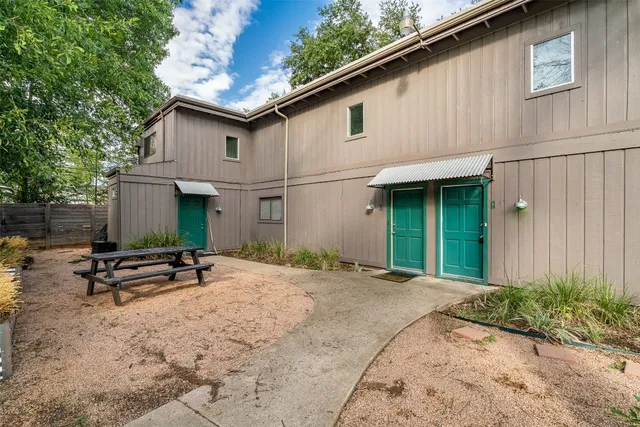 a backyard of a house with seating space